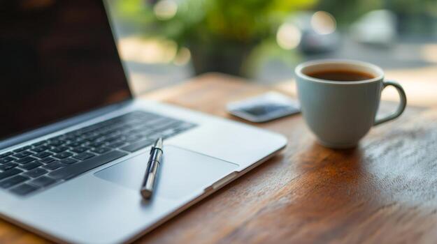 Morning desk scene with an open planner, a pen and a coffee cup beside a window with natural light